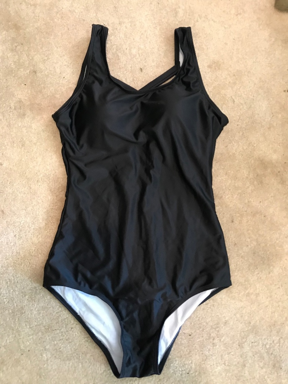 Woman’s black one piece bathing suit